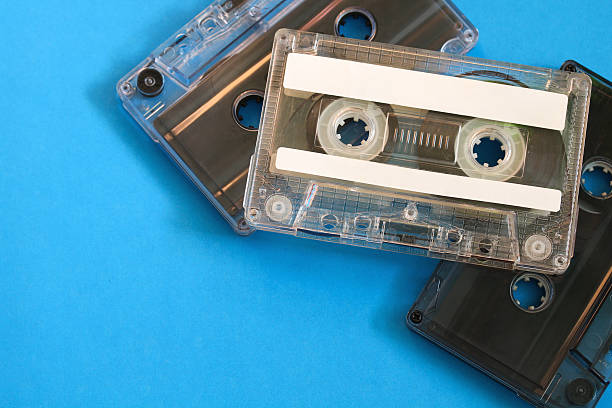istock Clear plastic cassette tapes on blue background 2238784968