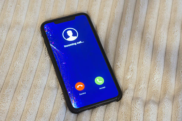 istock Smartphone displaying an incoming call screen with Decline and Accept buttons. Concept of communication and social networking. 2238785449