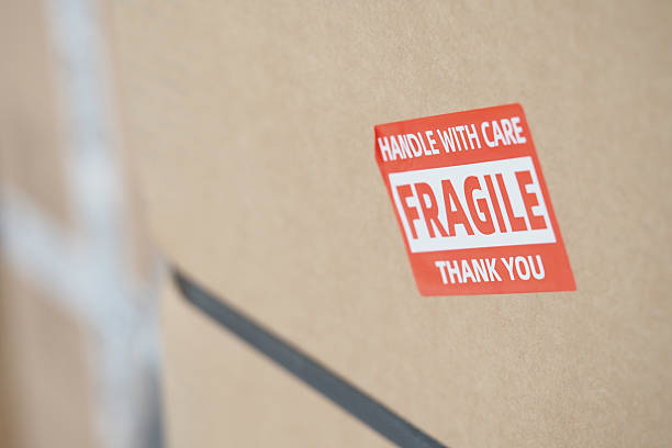 Package clearly labeled with fragile warning and handling instructions.