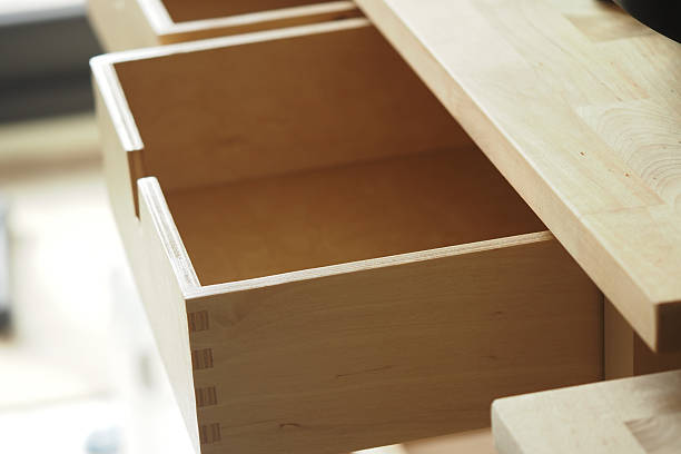 istock Wooden drawer partially open in a modern workspace 2238786182