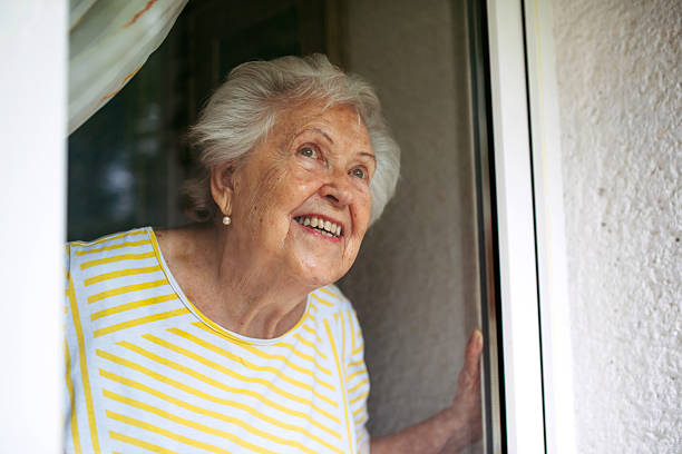 istock Cute old lady on balcony. 2238794797