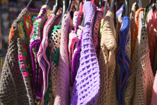 Bridesmaid floral pattern dresses assortment hanging up
