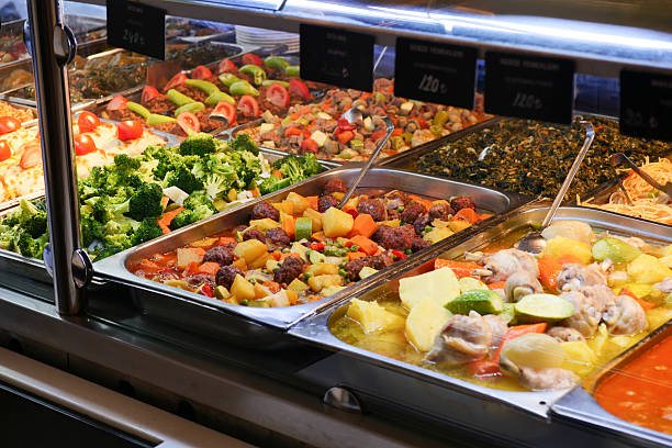 Colorful buffet display of fresh vegetables and hearty dishes