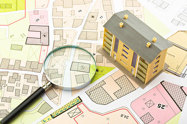istock Imaginary cadastral map and general urban plan with cadastral parcels, urban destinations, vacant land plots and condominium residential building 2238800182