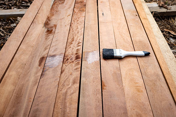 istock Paint brush and wood material in construction work. 2238800727