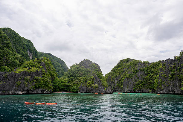 istock Aerial view of kayaks exploring tropical lagoon 2238802070