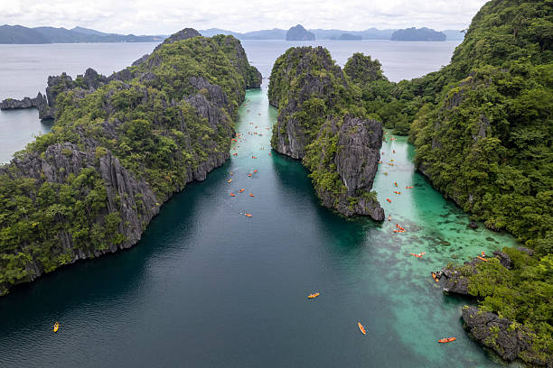 istock Aerial view of kayaks exploring tropical lagoon 2238802104