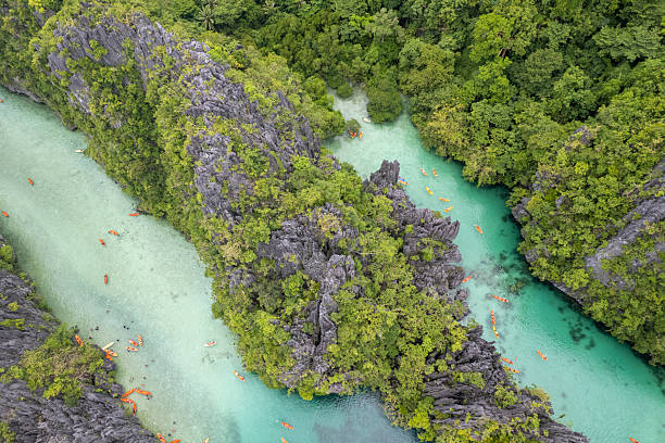 istock Aerial view of kayaks exploring tropical lagoon 2238802128