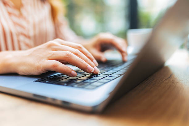 istock Unrecognisable Woman Working on Laptop in Cafe 2238803031