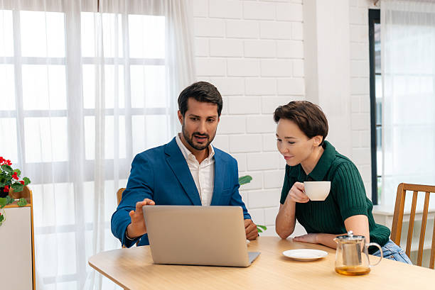 istock Financial Advisor Reviewing Investment Plan with Female Client 2238804484