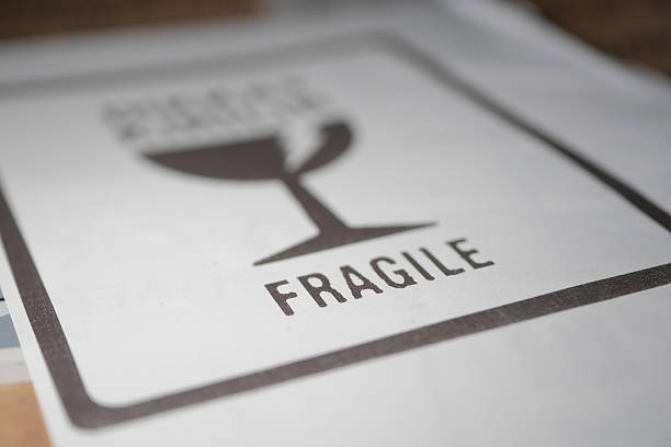 Label displays a fragile symbol with clear instructions for handling.