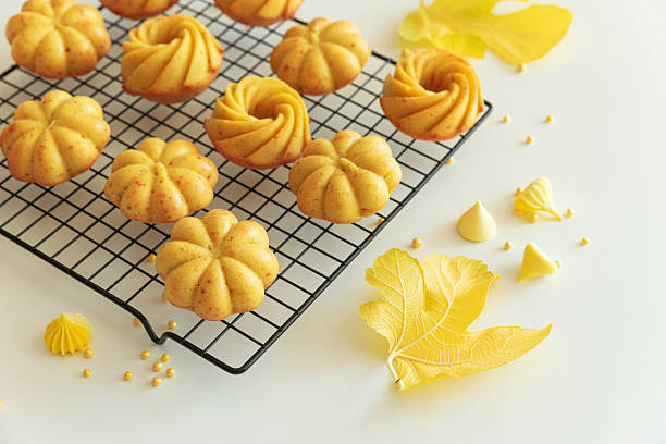istock Autumn-Themed Mini pumpkin Cakes with Seasonal Decorations on White Background 2238806470