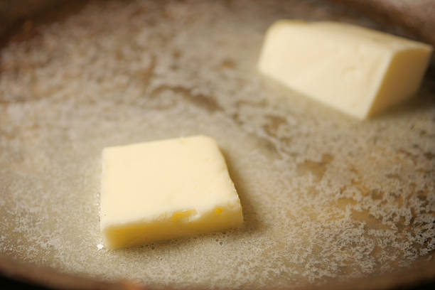 istock Melting butter in a pan on a stove 2238806480