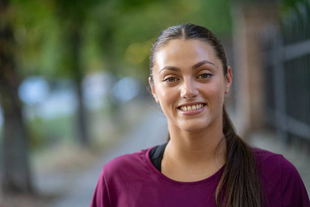istock Young woman smiling at sunset 2238807750