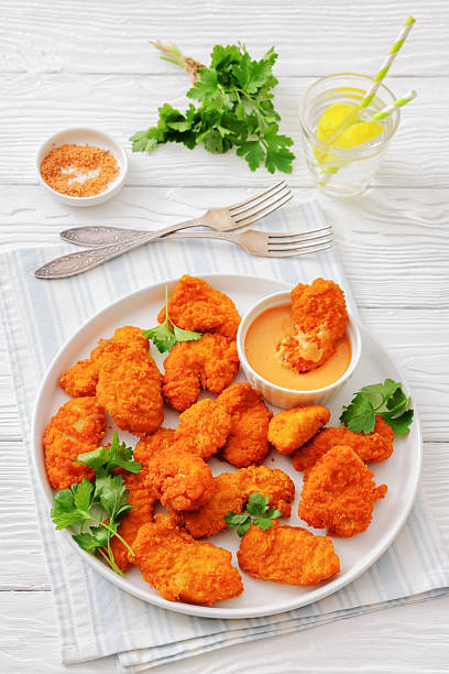 istock breaded chicken breast chunks with dipping sauce 2238809818