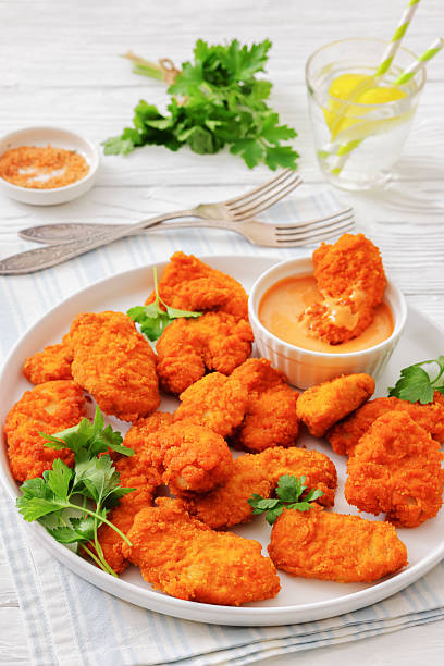 istock breaded chicken breast chunks with dipping sauce 2238809953