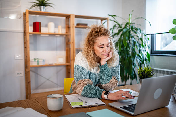 istock Woman feeling tired while working on laptop at home 2238810306
