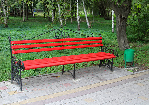 Wooden bench in a park with mass attendance and recreation