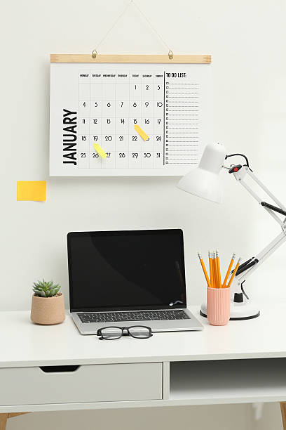 istock Desktop calendar on a modern desktop. Schedule and time planning in office and business. 2238812969