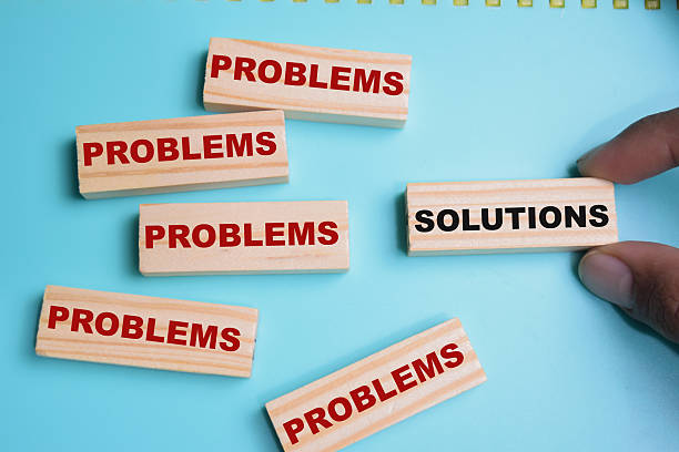 istock Solutions or problems on stacked wooden cubes on the table. Business and finance concept 2238823906