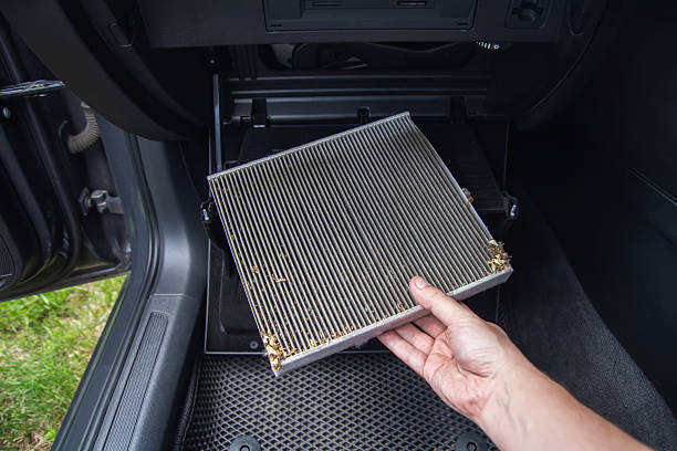 istock Mechanic's hand replacing old car cabin filter with new clean filter, close-up, industry, antibacterial 2238823968