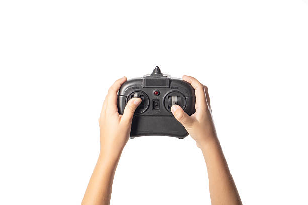 istock Black joystick for gaming in children's hands on a white background, isolate, close-up 2238826313