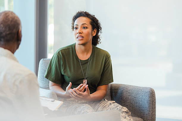 istock Veteran in military uniform discusses challenges in counseling session with a professional 2238826404