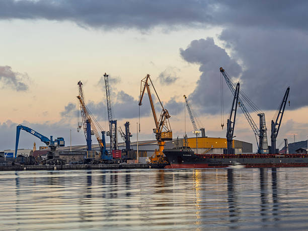 Avilés, Asturias, Spain, September 27, 2025: Large cranes at dawn in the port of Avilés, Asturias