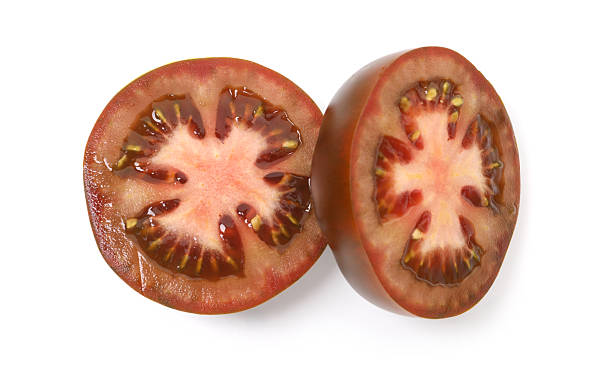 istock Pieces of brown tomatoes isolated on white, top view 2238827394