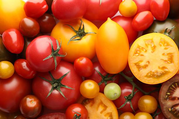 istock Different ripe juicy tomatoes as background, closeup 2238827542