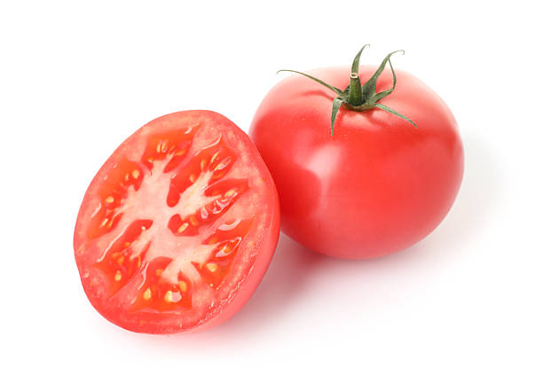 istock Whole and cut red tomatoes isolated on white 2238827670