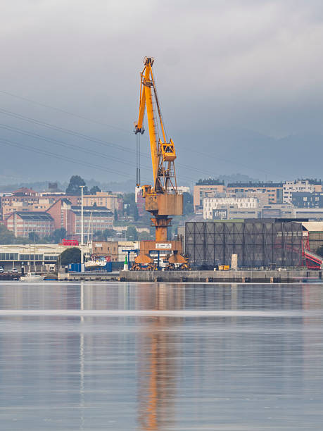 Avilés, Asturias, Spain, September 27, 2025: Large cranes at dawn in the port of Avilés, Asturias
