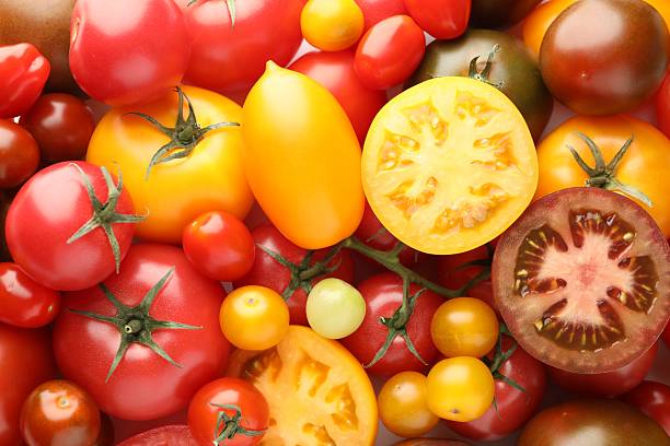 istock Different ripe juicy tomatoes as background, closeup 2238828078