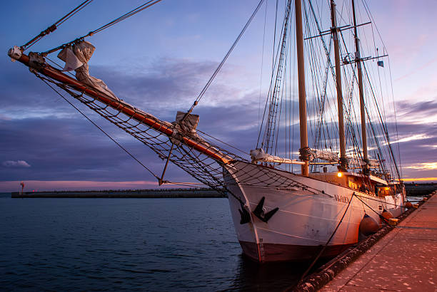August 17th. 2024. Port-Camargue is a district of the town of Le Grau-du-Roi, in the Gard department in the administrative region of Occitanie, Languedoc France.. Built in the 1960s, it is today one of the biggest marinas in Europe. Wooden sailing ship.