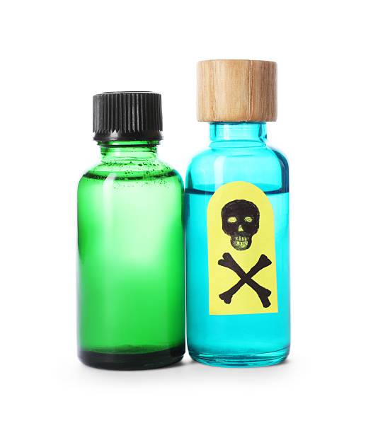 istock Bottles of poisons with warning sign isolated on white 2238834897