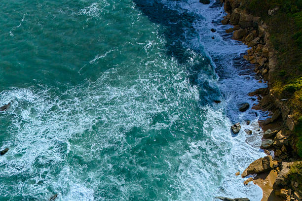 Aerial seascape with turquoise water and rocks