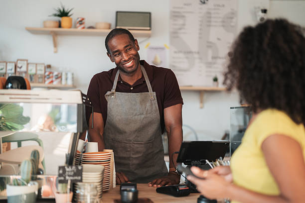 istock Customer order and pay at a coffee shop counter 2238857051