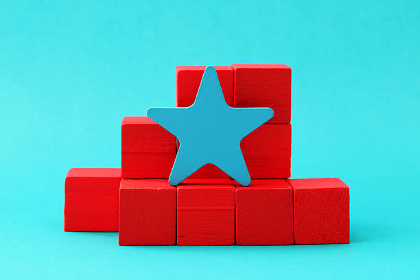 Leader star on wooden blocks