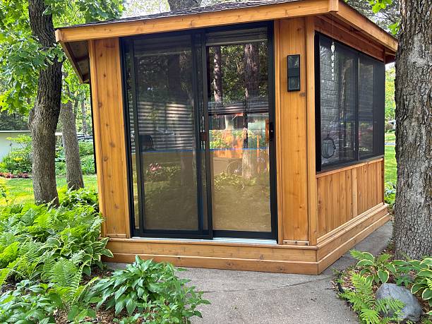 istock Cedar gazebo with sliding glass door in wooded setting 2238869175