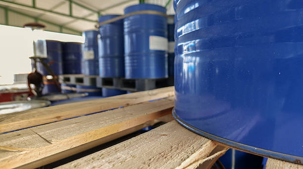 istock Blue chemical storage tanks placed inside a warehouse, representing industrial storage, 2238870071