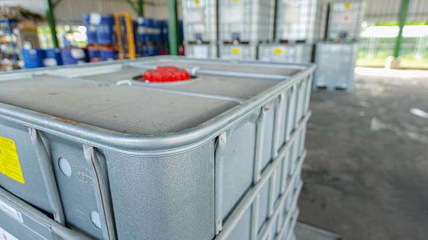 istock Square-shaped chemical storage tanks with reinforced steel frame for load support, placed in a warehouse awaiting shipment, 2238870094