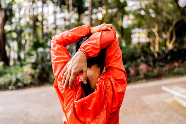 istock Mature woman doing stretching exercise outdoors 2238870281