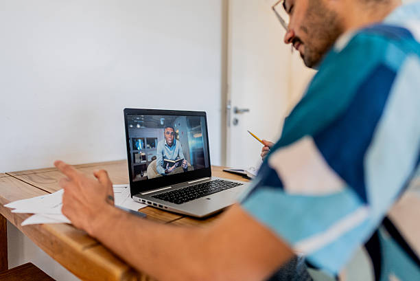 istock Businessman in video call working remotely from home 2238871265