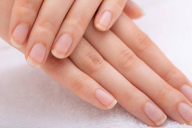 istock Female hands with beautifully manicured fingernails 2238873413