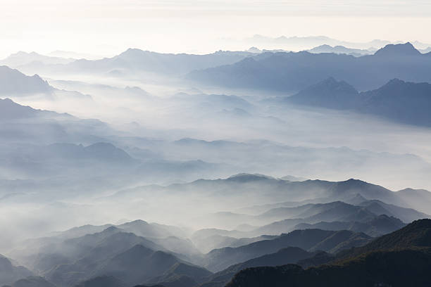 Sunlit sky at sunrise, outdoor mountain scenery, natural background.