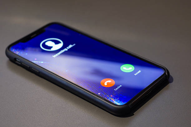 istock Smartphone displaying an incoming call screen with Decline and Accept buttons. Concept of communication and social networking. 2238874811