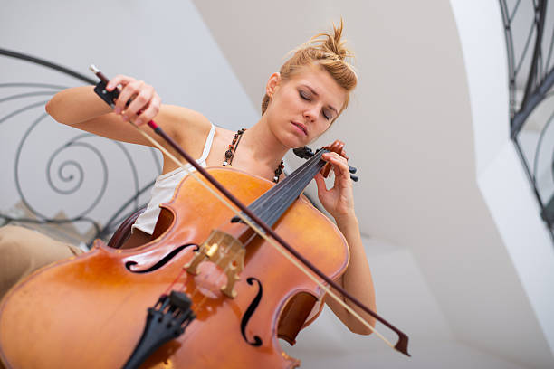 istock Young woman cellist playing cello 2238879768