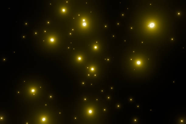 Lots of yellow glowing particles on a black background