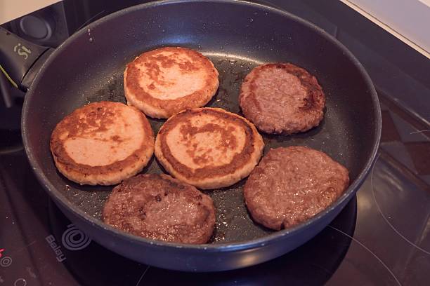 istock Chicken Cutlets and Beef Patties Frying in Pan 2238883361