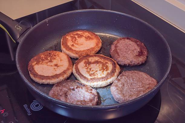 istock Chicken Cutlets and Beef Patties Frying in Pan 2238883364